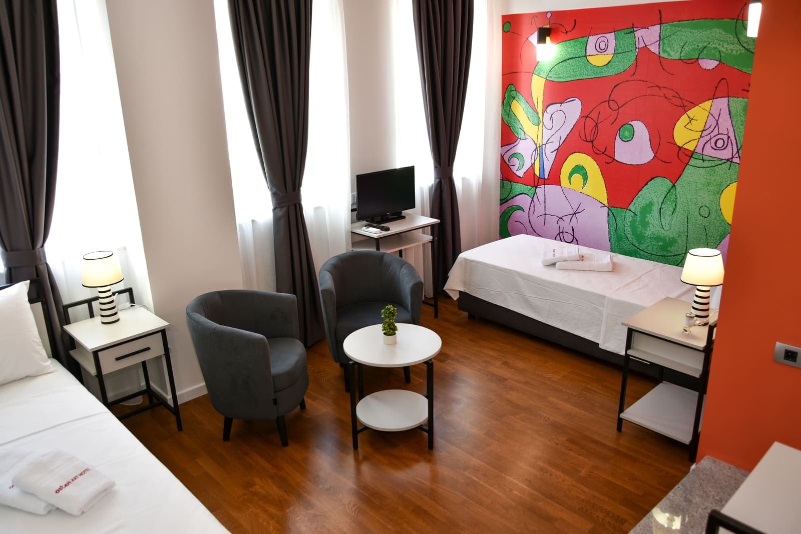 Twin room with abstract mural — Room 5